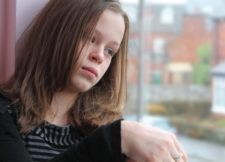 Girl looking out window rev